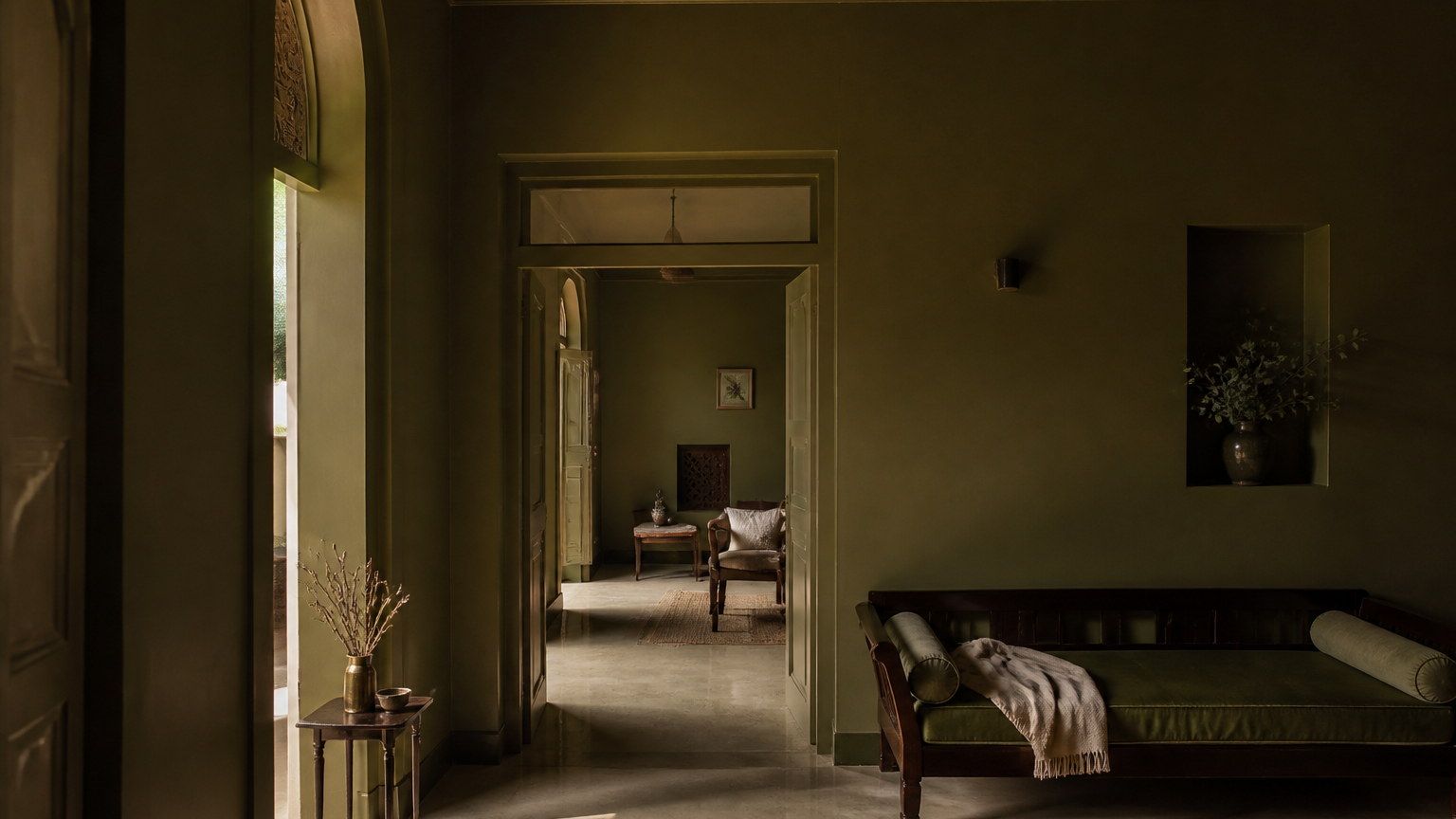 Colour-drenched interior with walls, ceiling and joinery in one deep muted earth hue