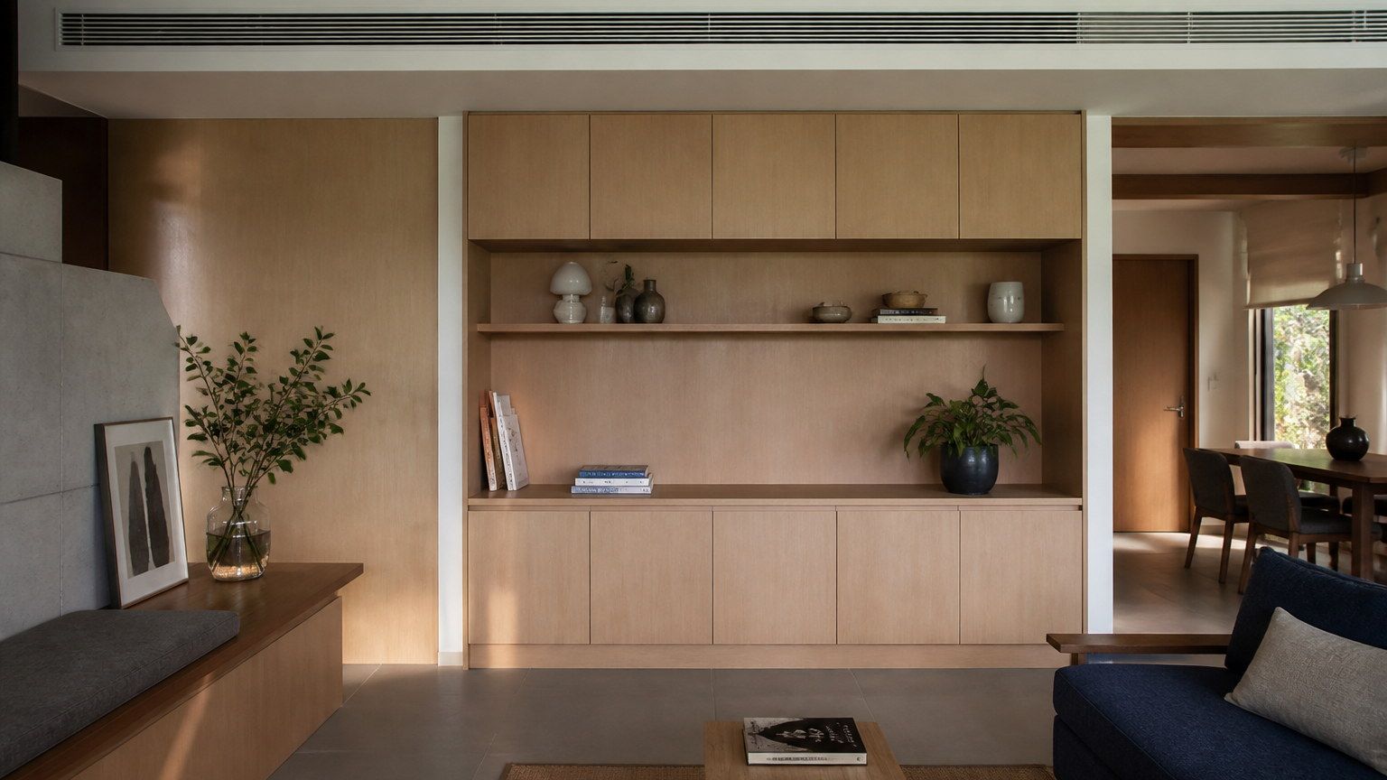 Calm interior with extensive timber millwork in a sealed contemporary Indian room