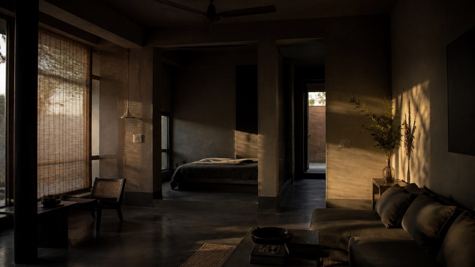 Interior defined by grazing daylight on textured plaster and deep foreground shade