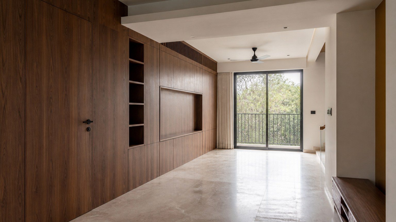 Wide residential interior where storage is built into the architecture