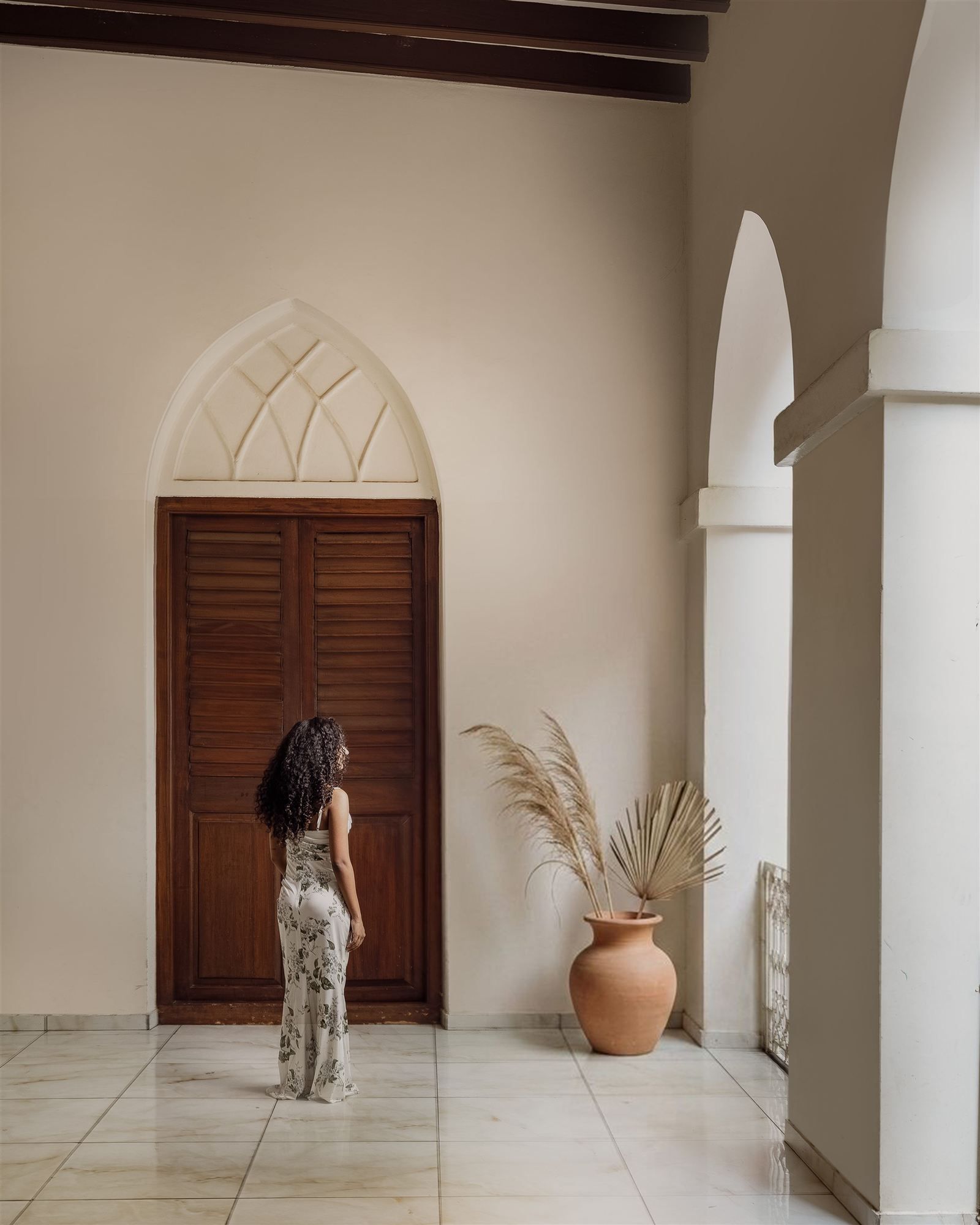 Wood-panelled corridor with pendant lighting
