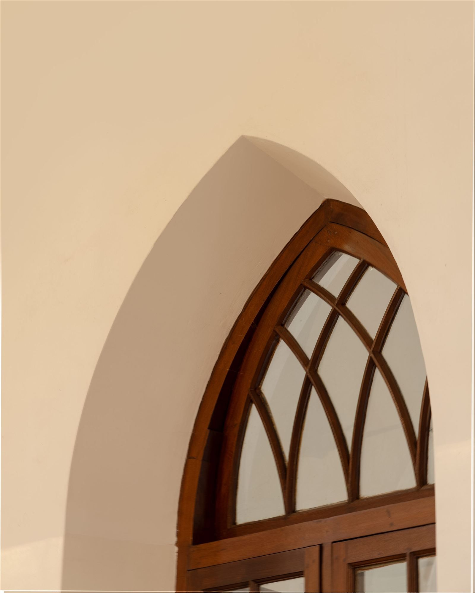 Close detail of a restored arched window frame
